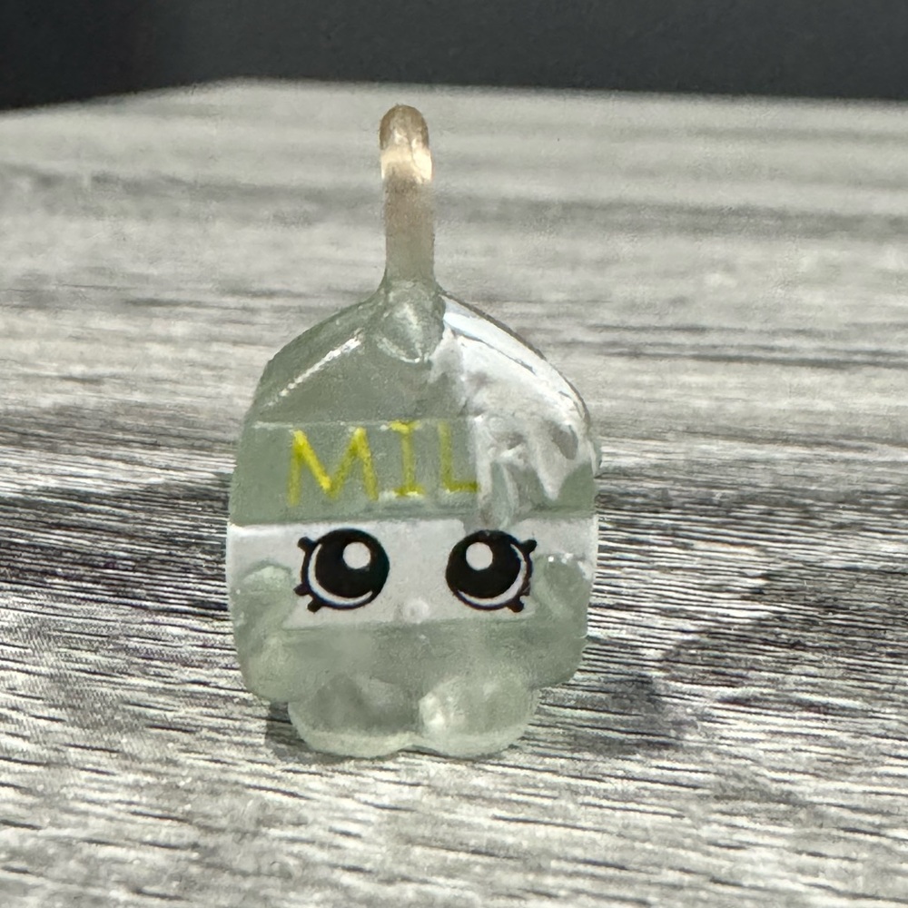 Shopkins |  Charms: Translucent Spilt Milk (5-116) - Collectible Mini Figure